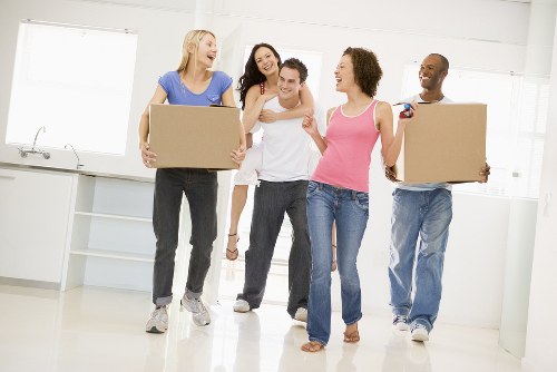 Removal team planning a move in a Hammersmith street with local flats and parking considerations