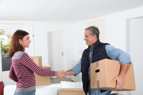Local movers helping with furniture in a Hammersmith flat
