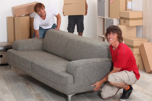 Packed moving boxes and furniture prepared for a Hammersmith home move