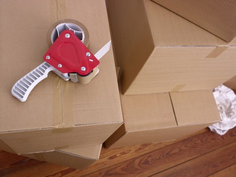Careful handling of boxes and furniture during a flat move in Hammersmith