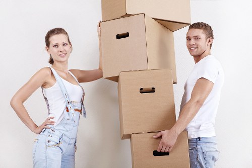 Local movers loading furniture into a truck in Hammersmith